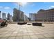 Expansive rooftop deck offering outdoor seating and stunning city skyline views with a construction site at 1421 Peachtree Ne St # 415, Atlanta, GA 30309