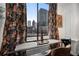 Stunning city views framed by decorative curtains, offering a glimpse of the urban landscape at 1421 Peachtree Ne St # 415, Atlanta, GA 30309