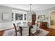 Formal dining room with chandelier, bay window, and access to adjacent rooms at 1664 West Wesley Nw Rd, Atlanta, GA 30327