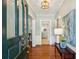Elegant entryway features hardwood floors, stylish lighting, and a view to the kitchen at 1664 West Wesley Nw Rd, Atlanta, GA 30327