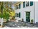 Charming home exterior with white siding, green shutters, and lush landscaping at 1664 West Wesley Nw Rd, Atlanta, GA 30327