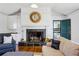 Cozy fireplace with a white mantel, stone hearth, and built-in cabinets at 1664 West Wesley Nw Rd, Atlanta, GA 30327