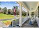 Inviting front porch with stone floor and rocking chairs offers a relaxing outdoor space at 1664 West Wesley Nw Rd, Atlanta, GA 30327
