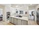 Spacious kitchen with white cabinets, center island, and modern appliances offers ample cooking space at 1664 West Wesley Nw Rd, Atlanta, GA 30327