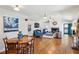 Open-concept living room features hardwood floors, fireplace, and access to the patio at 1664 West Wesley Nw Rd, Atlanta, GA 30327