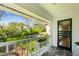 Cozy porch with stone floor and views of the landscaped backyard at 1664 West Wesley Nw Rd, Atlanta, GA 30327