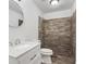 Bathroom featuring sleek marble countertop and tile-surround shower at 2113 Pine Tree Trl, Atlanta, GA 30349