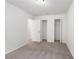 Bedroom with closet space featuring neutral walls and carpeted floors at 2113 Pine Tree Trl, Atlanta, GA 30349