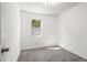 Cozy bedroom featuring neutral walls, carpeted floors and bright window view at 2113 Pine Tree Trl, Atlanta, GA 30349