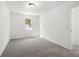 Comfortable bedroom featuring neutral walls, carpeted floors and a bright window view at 2113 Pine Tree Trl, Atlanta, GA 30349