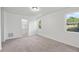 Carpeted bedroom with ample natural light and a walk-in closet with shelving at 2113 Pine Tree Trl, Atlanta, GA 30349