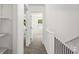 Hallway view with carpeted floors that leads to the various rooms of the home at 2113 Pine Tree Trl, Atlanta, GA 30349