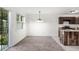 Kitchen has stainless appliances, neutral paint and carpet with access to outside through sliding doors at 2113 Pine Tree Trl, Atlanta, GA 30349