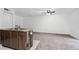 Living room with open-concept kitchen with a wood-clad island and stainless faucet at 2113 Pine Tree Trl, Atlanta, GA 30349