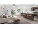 Open-concept living room features a modern kitchen, cozy seating, and bright natural light at 2113 Pine Tree Trl, Atlanta, GA 30349