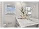 Bathroom featuring a marble countertop, double sinks, and a large mirror at 4178 Castle Pines Ct, Tucker, GA 30084