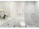 Modern bathroom with double vanity, marble countertops, and walk-in shower at 4178 Castle Pines Ct, Tucker, GA 30084
