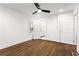 Bright bedroom features hardwood floors and an open doorway to the bathroom at 4178 Castle Pines Ct, Tucker, GA 30084