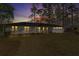 Home at dusk featuring a brick exterior, front lawn, and inviting curb appeal at 4178 Castle Pines Ct, Tucker, GA 30084