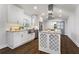 Modern kitchen featuring white cabinets, stainless steel appliances, granite countertops, and a stylish island at 4178 Castle Pines Ct, Tucker, GA 30084