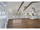 An open concept living area with hardwood floors and seamless transition to the kitchen at 4178 Castle Pines Ct, Tucker, GA 30084