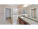 Bright bathroom with granite countertop, glass-enclosed shower, and convenient access to a walk-in closet at 970 Prance Dr, Kennesaw, GA 30144