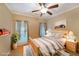 Cozy bedroom with a wooden bed frame, neutral decor, and natural light at 970 Prance Dr, Kennesaw, GA 30144