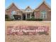 Charming brick ranch home featuring manicured landscaping and arched windows for great curb appeal at 970 Prance Dr, Kennesaw, GA 30144