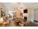 Inviting living room with a cozy fireplace, ceiling fan, and open layout with seamless access to the kitchen at 970 Prance Dr, Kennesaw, GA 30144
