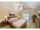Serene main bedroom with vaulted ceiling, fan, and a decorative window to bring in natural light at 970 Prance Dr, Kennesaw, GA 30144