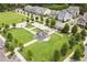 Aerial view of a well-maintained community park with a gazebo and walking paths, surrounded by charming residential homes at 1818 Cromwell Walk, Dunwoody, GA 30338