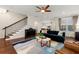 Spacious living room featuring hardwood floors, a piano, and an open floor plan at 1818 Cromwell Walk, Dunwoody, GA 30338