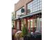 Exterior view of Local on North Eatery and Bar with large windows, red doors, and attractive flower boxes at 2400 Edgar Park Pl # 103, Duluth, GA 30096