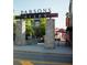 Parsons Alley entrance with stone pillars and signage, offering a glimpse of nearby restaurants and shops at 2400 Edgar Park Pl # 103, Duluth, GA 30096