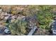An aerial view of a quaint brown home showcasing a driveway, lush greenery, and surrounding neighborhood rooftops at 313 5Th Ne St, Atlanta, GA 30308
