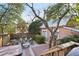 Backyard with a raised deck leading to a seating area around a fire pit at 313 5Th Ne St, Atlanta, GA 30308
