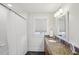 Bathroom with granite countertop vanity, shower and bath with shower curtain at 313 5Th Ne St, Atlanta, GA 30308