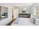 Cozy bedroom featuring hardwood floors, a sitting area, and lots of natural light at 313 5Th Ne St, Atlanta, GA 30308