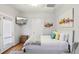 Comfortable bedroom with light gray walls, hardwood floors, and natural light at 313 5Th Ne St, Atlanta, GA 30308