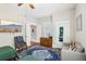 Bedroom featuring two twin beds, soft couch and a large area rug at 313 5Th Ne St, Atlanta, GA 30308