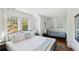 Bright bedroom with comfortable queen bed, daybed and plenty of natural light at 313 5Th Ne St, Atlanta, GA 30308
