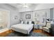 Comfortable bedroom featuring a ceiling fan, white walls and wooden floors at 313 5Th Ne St, Atlanta, GA 30308