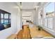 A beautiful dining area featuring hardwood floors and stylish décor, adjacent to the well-lit kitchen at 313 5Th Ne St, Atlanta, GA 30308