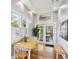 Bright dining area with white trim, natural light, and a view of the outdoor patio with a dining table at 313 5Th Ne St, Atlanta, GA 30308