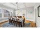 Bright dining room with hardwood floors, a coffered ceiling and view into the kitchen at 313 5Th Ne St, Atlanta, GA 30308