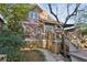 Charming home exterior with a spacious wooden deck and beautifully landscaped yard at 313 5Th Ne St, Atlanta, GA 30308