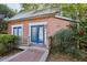 Cozy home with a charming exterior, featuring a small porch and surrounded by lush greenery at 313 5Th Ne St, Atlanta, GA 30308