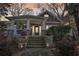 Charming home with a stone porch, large columns, and professional landscaping at 313 5Th Ne St, Atlanta, GA 30308