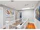 Upstairs hallway features skylights and hardwood floors, creating a bright and airy feel at 313 5Th Ne St, Atlanta, GA 30308