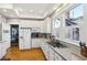Charming kitchen features gas cooktop, hardwood floors, and ample counter space at 313 5Th Ne St, Atlanta, GA 30308